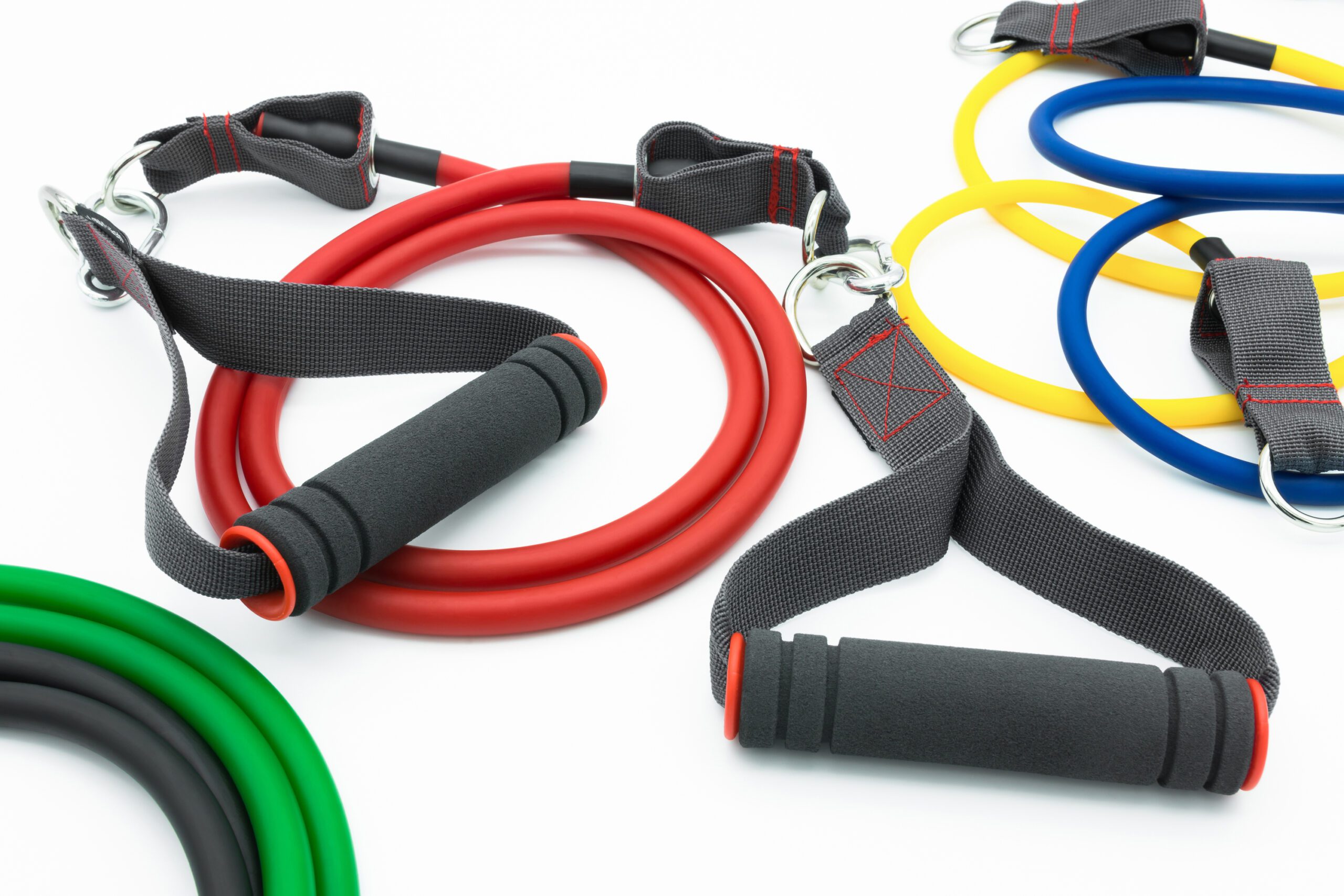Colorful resistance bands isolated on the white background. Bridgeport In-Home Fitness