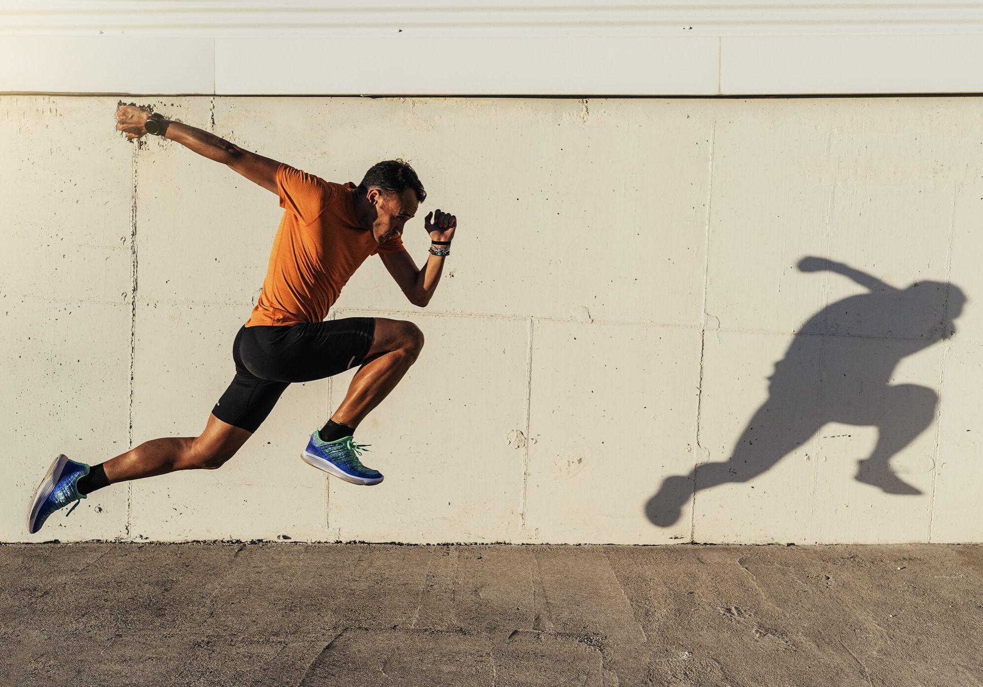 Handsome man running in the city. Bridgeport In-Home Fitness